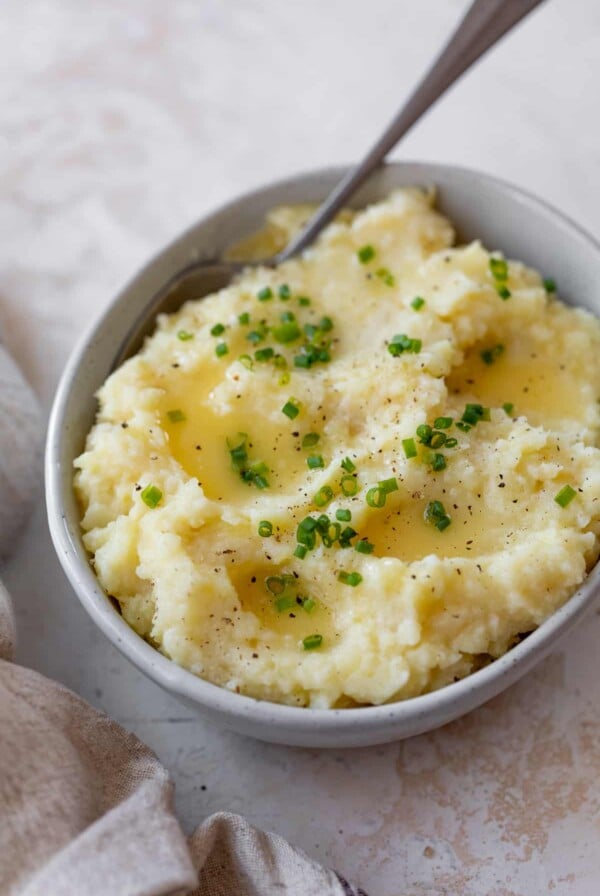 mashed parsnips in a bowl with a spoon